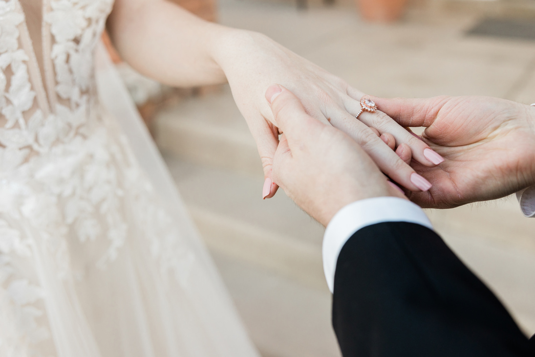 Groom Putting on Ring on Bride's Finger