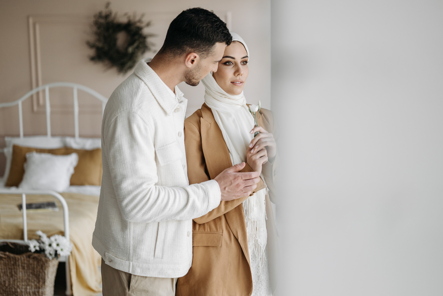 A Couple Standing Inside the Bedroom